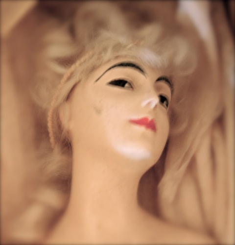 Surreal photo of a doll\'s head